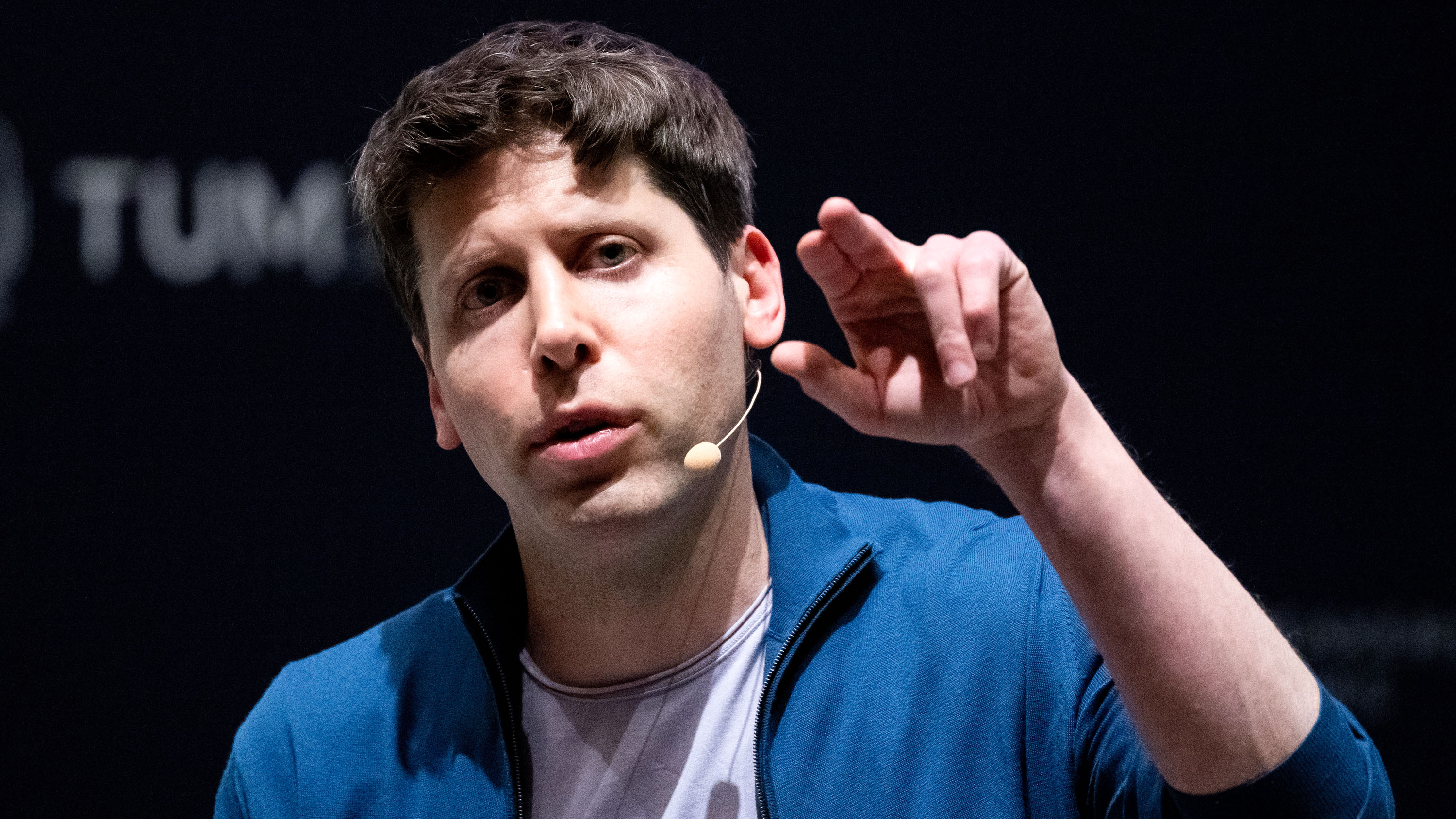 Open AI CEO Sam Altman speaking at a conference